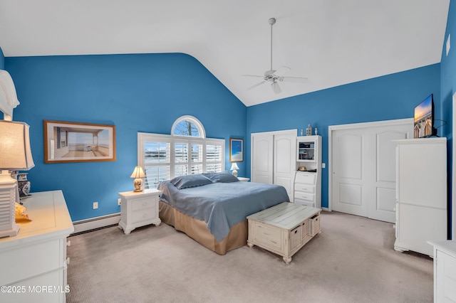 bedroom with light carpet, baseboards, baseboard heating, ceiling fan, and vaulted ceiling