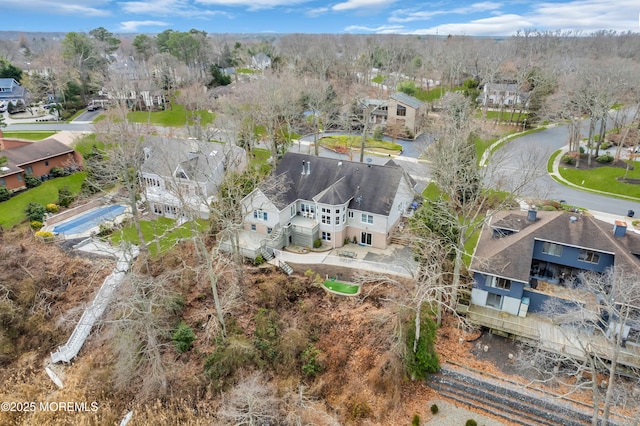 birds eye view of property with a residential view