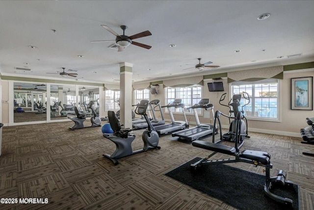 gym featuring ceiling fan, carpet flooring, visible vents, and baseboards