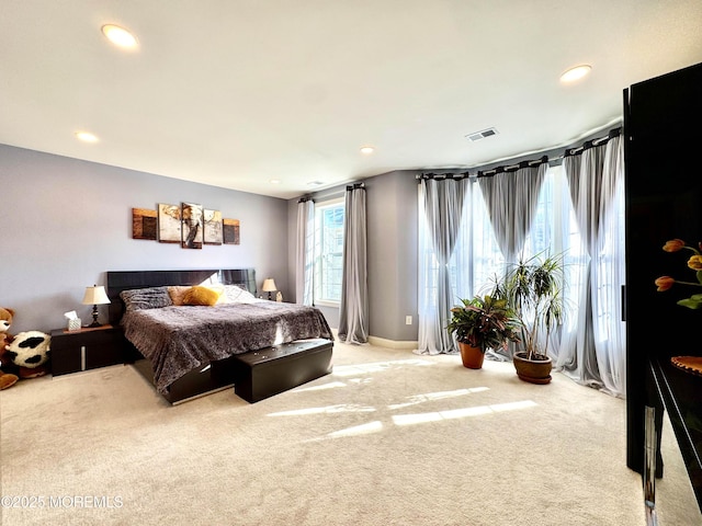 bedroom featuring visible vents, light colored carpet, and recessed lighting