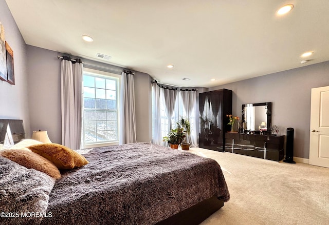 carpeted bedroom with baseboards, visible vents, and recessed lighting