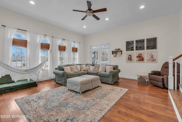 living area featuring recessed lighting, stairway, and wood finished floors