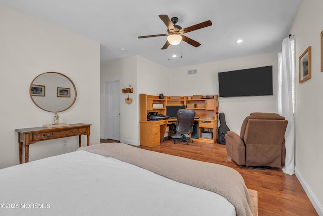 bedroom featuring baseboards, light wood finished floors, visible vents, and recessed lighting