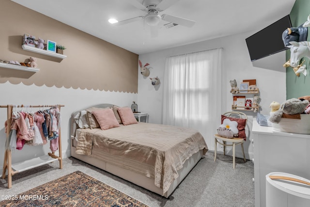 bedroom with a ceiling fan, carpet flooring, visible vents, and baseboards