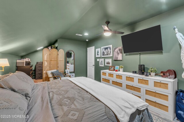 bedroom with vaulted ceiling, ceiling fan, and visible vents