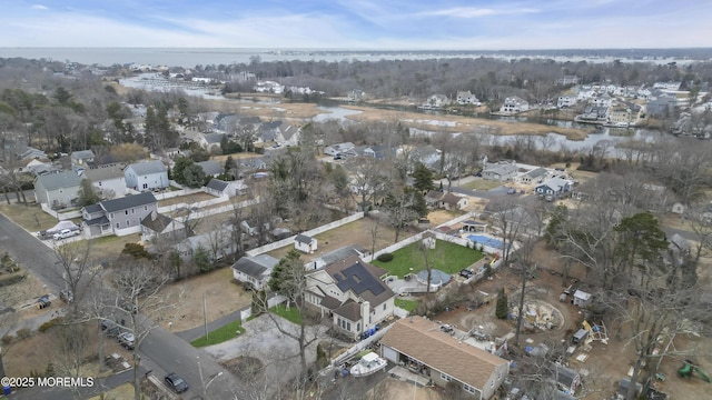 bird's eye view featuring a residential view and a water view