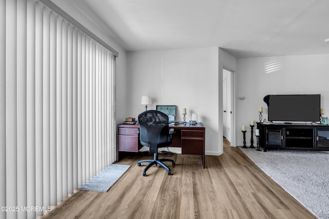 office with wood finished floors and baseboards