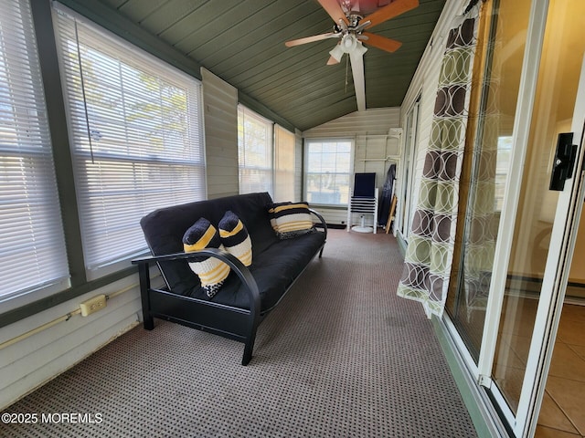 sunroom / solarium featuring lofted ceiling, wood ceiling, and ceiling fan