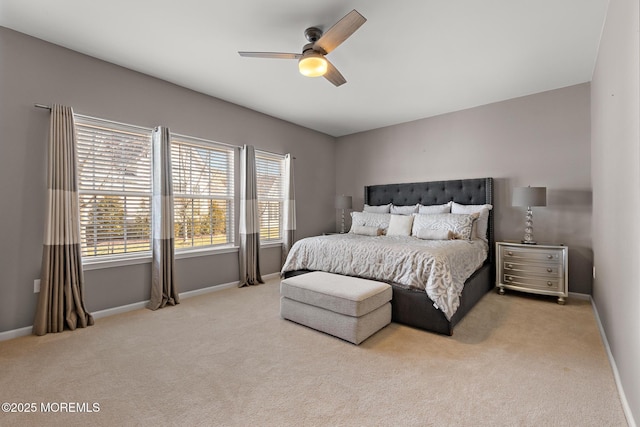 bedroom featuring ceiling fan, baseboards, and carpet flooring
