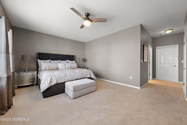 bedroom with a ceiling fan, baseboards, and carpet flooring