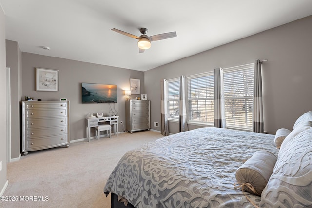 bedroom with carpet, ceiling fan, and baseboards
