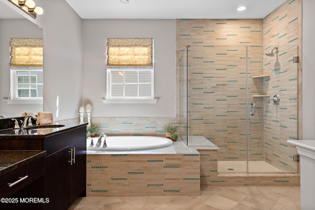 full bath featuring a garden tub, tile patterned flooring, a shower stall, and vanity