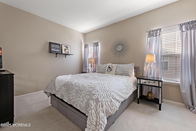 carpeted bedroom with baseboards