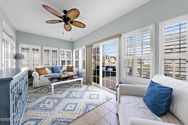 sunroom featuring ceiling fan