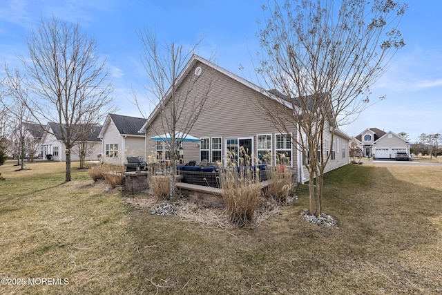 rear view of house with a patio area and a lawn