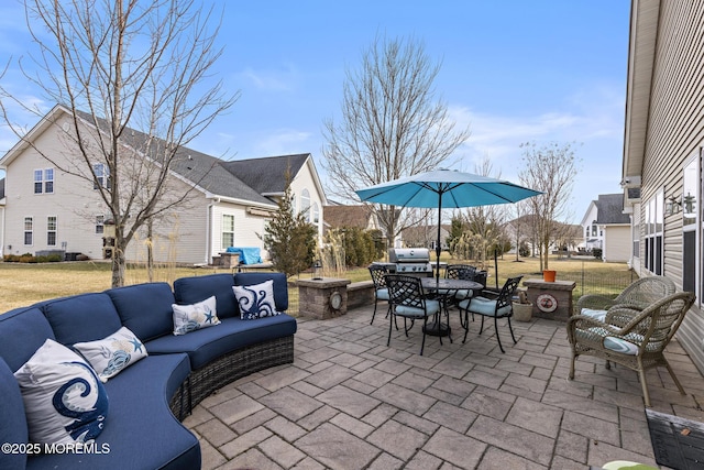 view of patio with outdoor dining area, a grill, and an outdoor living space