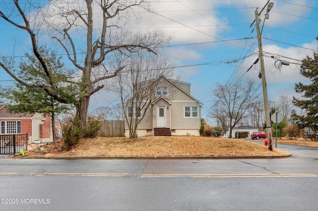 bungalow with entry steps and fence