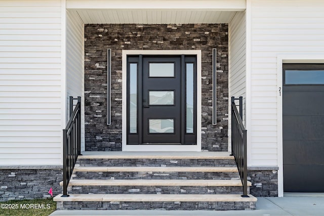 entrance to property featuring a garage