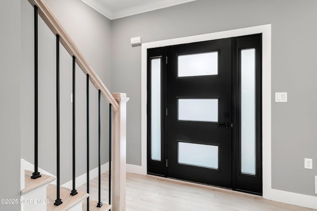 foyer with stairway and ornamental molding