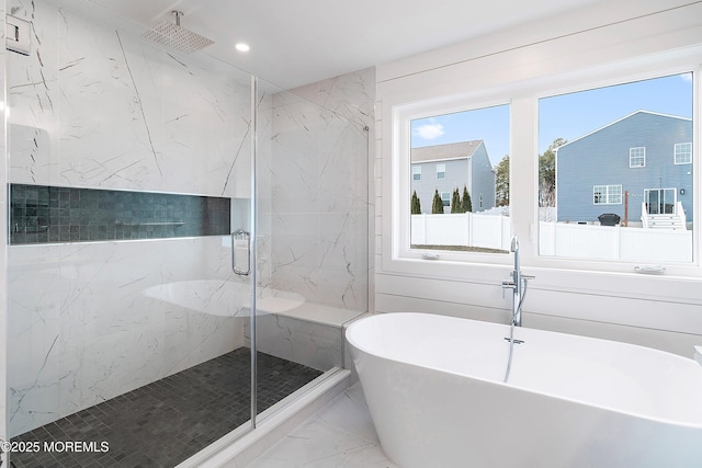 full bathroom featuring a soaking tub, recessed lighting, marble finish floor, and a marble finish shower