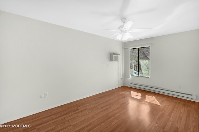 unfurnished room with wood finished floors, baseboards, a ceiling fan, a wall mounted AC, and a baseboard heating unit