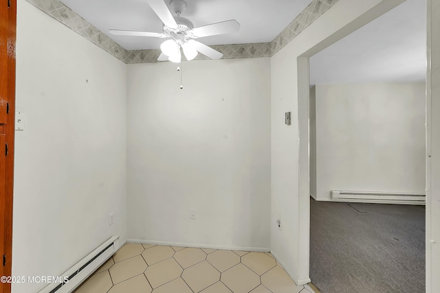 spare room with baseboards, baseboard heating, and ceiling fan