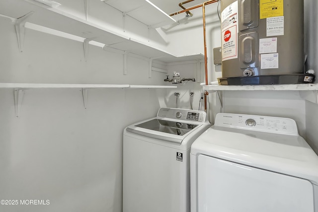 laundry area featuring separate washer and dryer, laundry area, and water heater