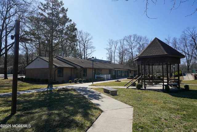 exterior space with a gazebo and a yard