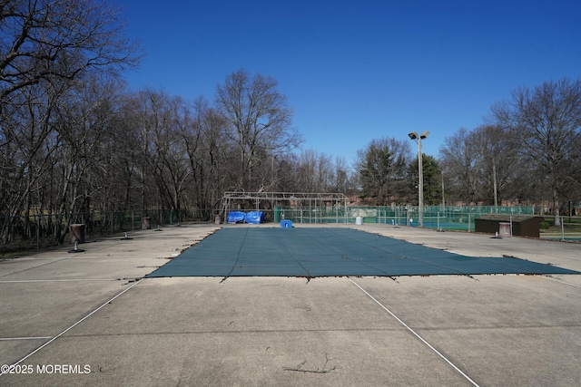 pool featuring a patio area and fence