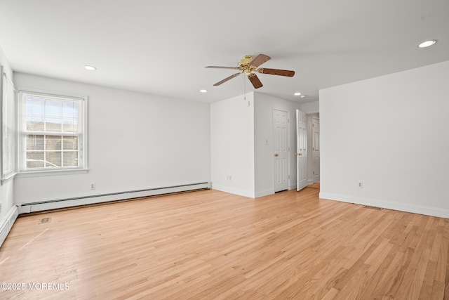 spare room with recessed lighting, light wood-style flooring, baseboard heating, ceiling fan, and baseboards