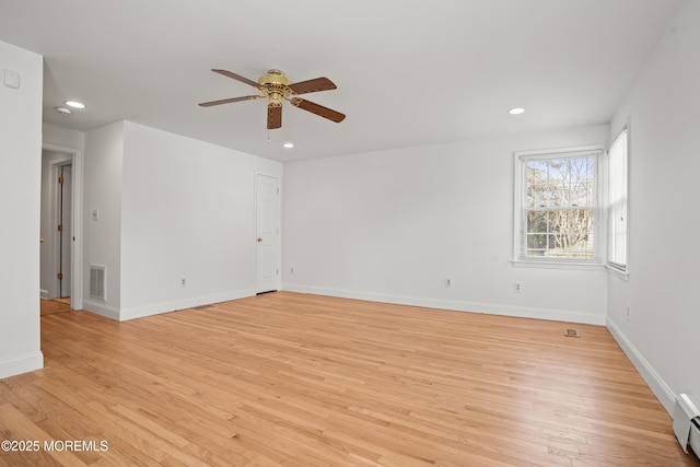 unfurnished room with light wood-type flooring, baseboards, and recessed lighting