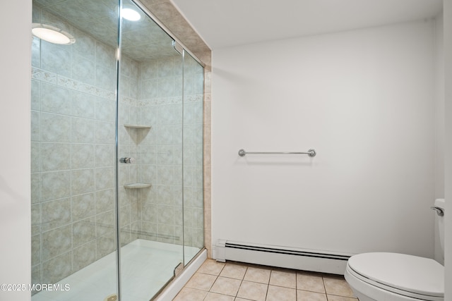 bathroom featuring toilet, tile patterned flooring, a baseboard heating unit, and a shower stall