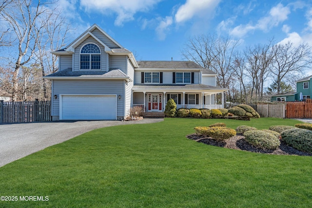 view of front of property with covered porch, fence, driveway, and an attached garage