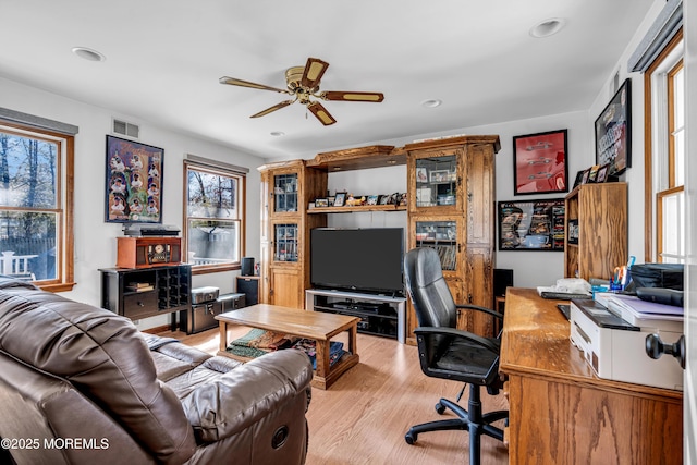 home office featuring ceiling fan, recessed lighting, visible vents, and light wood-style floors