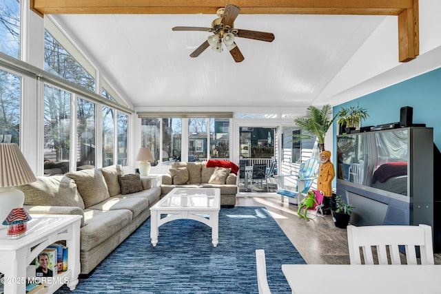 sunroom / solarium with vaulted ceiling, ceiling fan, and a healthy amount of sunlight