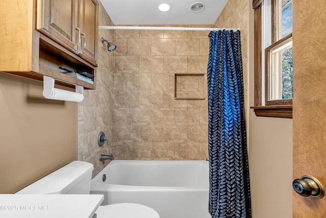 full bathroom with toilet and shower / bath combination with curtain