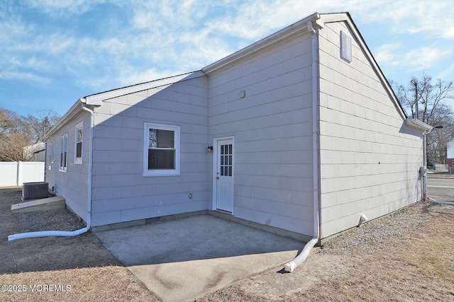 back of house featuring a patio area and fence