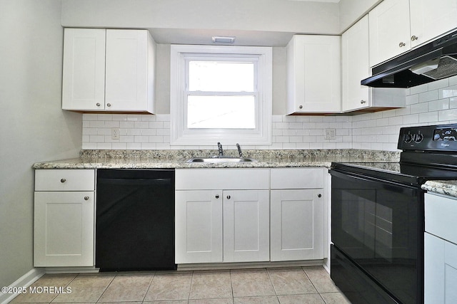 kitchen with under cabinet range hood, black appliances, white cabinetry, a sink, and light tile patterned flooring