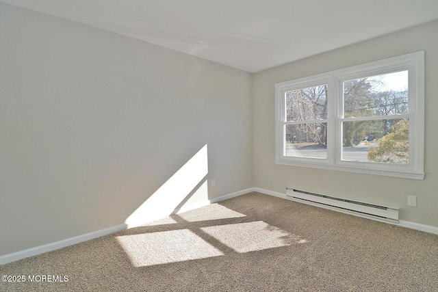 carpeted spare room featuring a baseboard radiator and baseboards