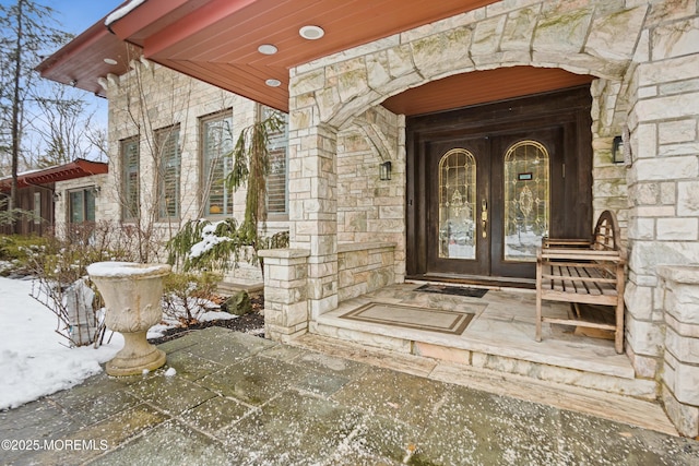 view of exterior entry with stone siding