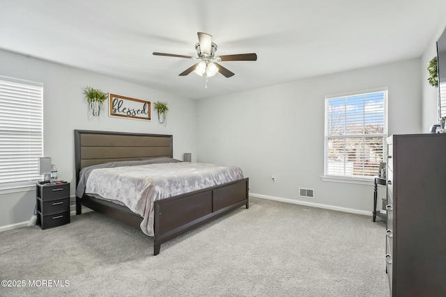 bedroom with a ceiling fan, carpet, visible vents, and baseboards