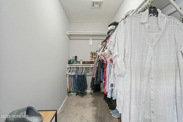 spacious closet with carpet floors and visible vents