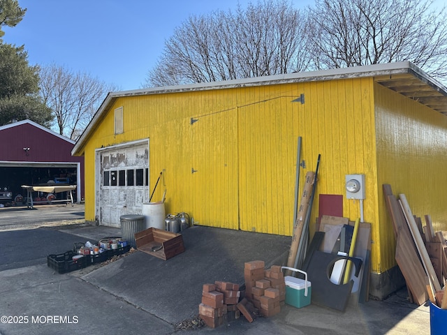 exterior space featuring a detached garage