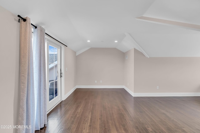 additional living space with lofted ceiling, recessed lighting, dark wood-style floors, and baseboards