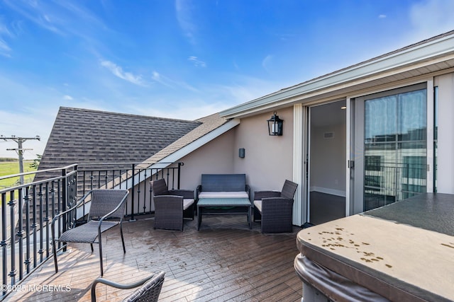 wooden deck featuring an outdoor hangout area