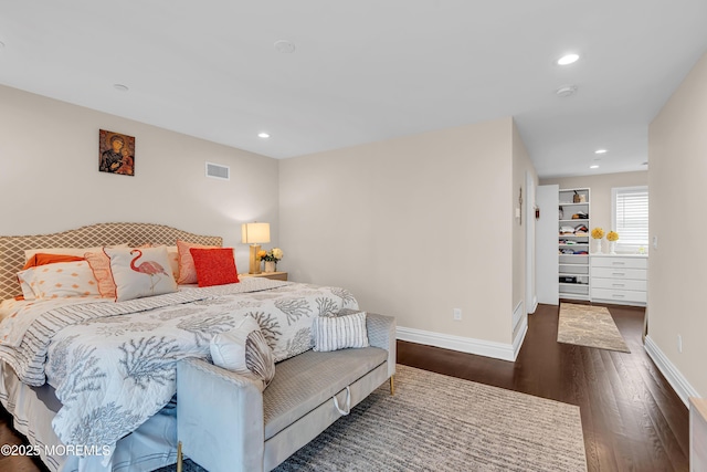 bedroom with recessed lighting, baseboards, visible vents, and dark wood-style flooring