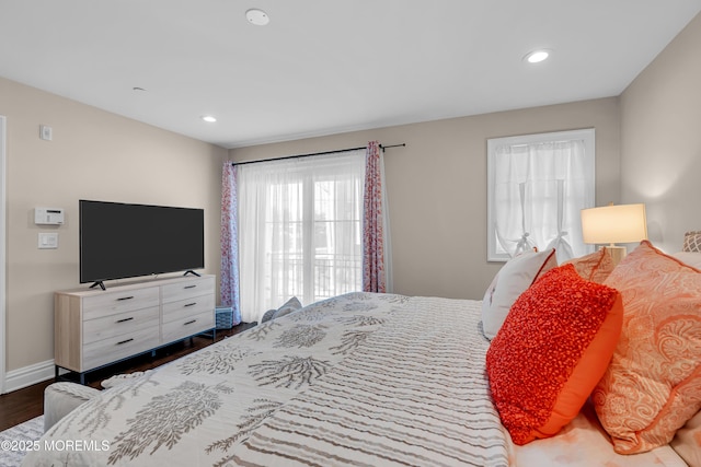 bedroom with recessed lighting, baseboards, and wood finished floors