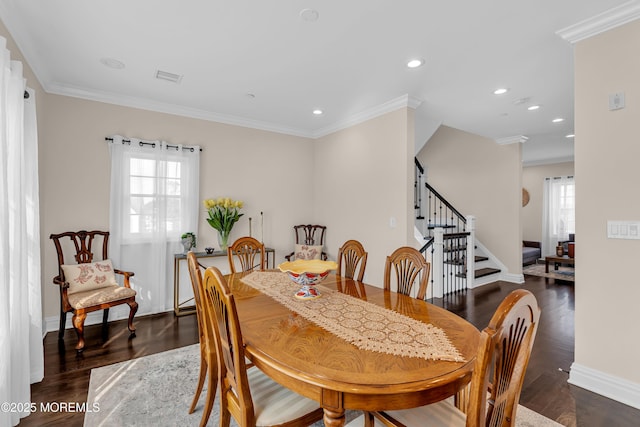 dining area with dark wood finished floors, recessed lighting, crown molding, baseboards, and stairs