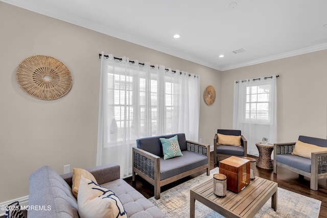 living room with visible vents, crown molding, recessed lighting, wood finished floors, and a baseboard radiator