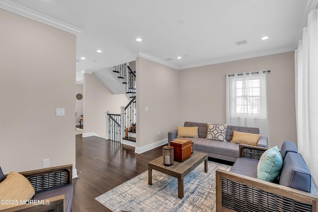 living room featuring ornamental molding, stairs, baseboards, and wood finished floors